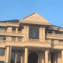 鞍山黄金麻别墅外墙干挂石材效果示例