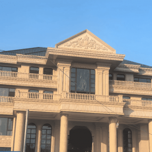 鞍山黄金麻别墅外墙干挂石材效果示例